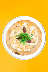 Neapolitan pizza with cheese and pear