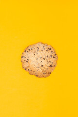 Chocolate chip coockie isolated on yellow background