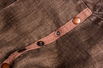 clothing items blue stonewashed faded jeans cotton fabric texture with seams, clasps, buttons and...