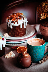 Easter cakes. Panettone. Traditional Easter cake with orange, candied fruit, raisins and cinnamon on a rustic background. Close-up