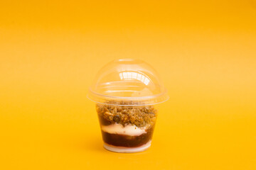 oat granola dessert with yogurt and jam in the jar for delivery