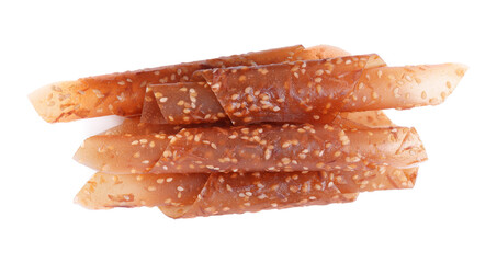 Delicious fruit leather rolls on white background, top view
