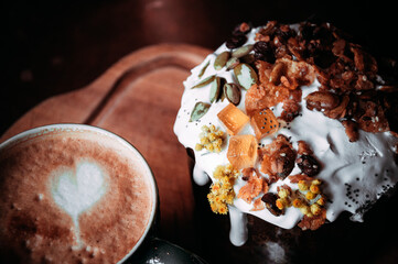 Easter cakes. Panettone. Traditional Easter cake with orange, candied fruit, raisins and cinnamon on a rustic background. Close-up