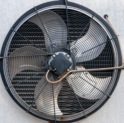 Fan blades, grille, and the outer part of the industrial air conditioner housing.
