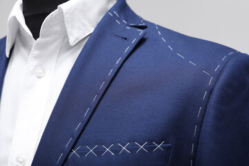 Semi-ready jacket and shirt on mannequin, closeup view