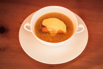 French Onion Soup in the Lyon Style Soupe à l Oignon Lyonnaise or Gratinée Lyonnaise in a White Bowl