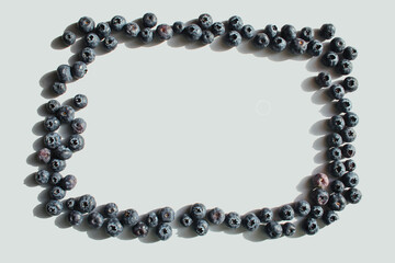 Blueberry isolated on a white background. Healthy food, raw food diet. Frame made of berries. Place for text.