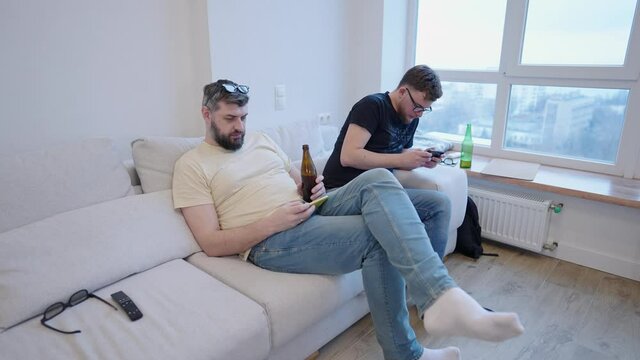 A modern home meeting where everyone is looking at their phones. Youth communication problems and smartphone addiction nomophobia