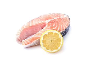 Salmon steak with lemon on white background closeup.  Fish isolated.
