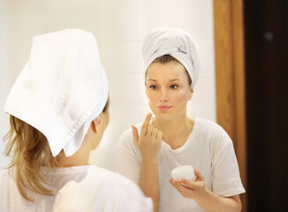 Magic anti-aging cream.Applying the cream.