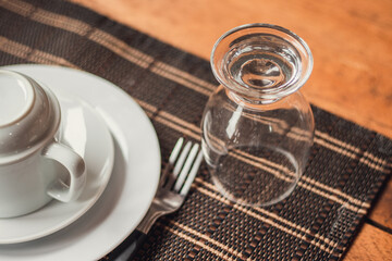 coffee cup and juice glass on a table