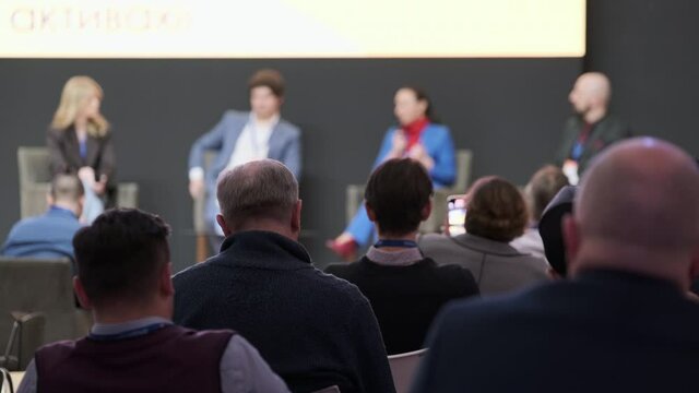 Audience listens to the lecturer