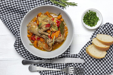 Homemade beer chicken stew with vegetables and aromatic herbs