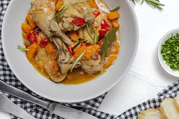 Homemade beer chicken stew with vegetables and aromatic herbs