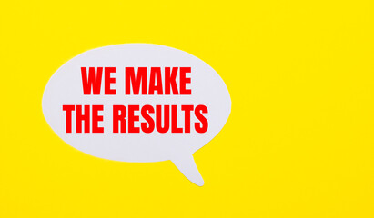 On a bright yellow background, white paper with the words WE MAKE THE RESULTS