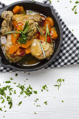 Homemade beer chicken stew with vegetables and aromatic herbs
