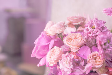 Beautiful light purple, pink, white cute delicate small roses of different sizes in a flower bouquet. Close-up. Template