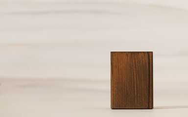 Natural wooden podium for organic eco frinedly cosmetic products against light background. Copy space