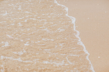Sea coast top view. Sand and wave. Nobody. Summertime.