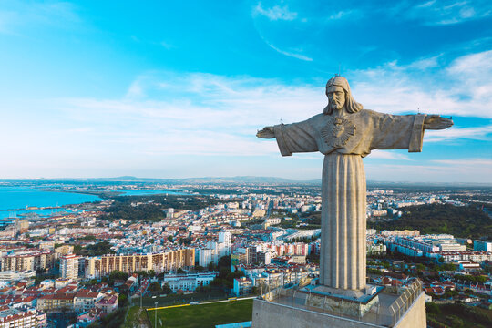 Aerial view of Sanctuary of Christ the King or Santuario de Cristo Rei on sunny summer day. Christ Statue in Lisbon, Portugal, 11.04.2021