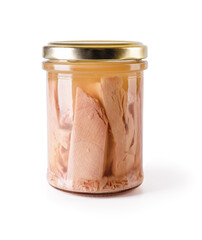Canned tuna fillet pieces in a glass jar with yellow metal lid isolated on white background. Preserved tuna fish meat as ingredient of low calories healthy eating. Seafood design element.