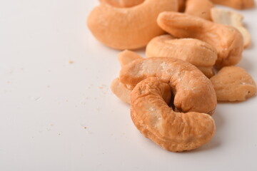 Heap of cashew nuts isolated on white background.