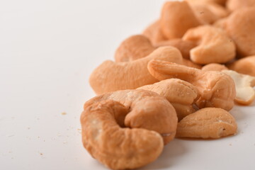 Heap of cashew nuts isolated on white background.