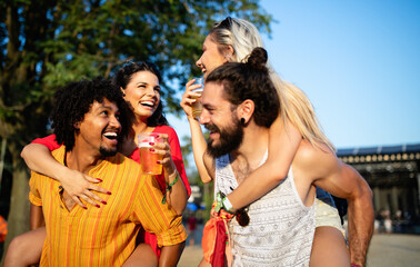 Group of friends having fun time at music festival