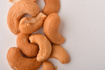 Heap of cashew nuts isolated on white background.