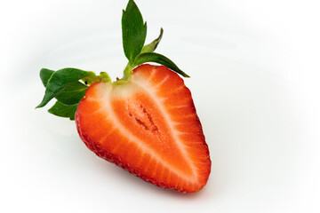 Red ripe strawberry slice isolated on white background