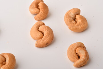 Heap of cashew nuts isolated on white background.
