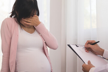 Young asian pregnant women have psychologist consultation at hospital or clinic,from panic and worried pregnancy condition, expecting family.Which must be treated with therapy before the baby is born.