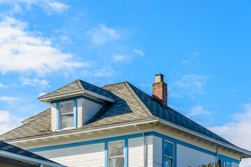 The roof of the house with nice window.