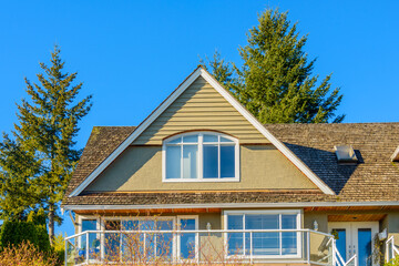 the top of the house under the blue sky