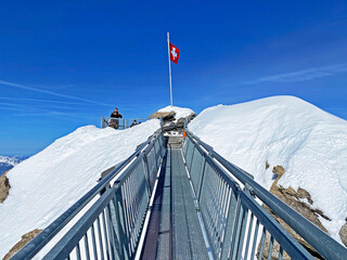 Peak walk on the Suspension bridge between two mountain peaks (Travel destination Glacier 3000) or...