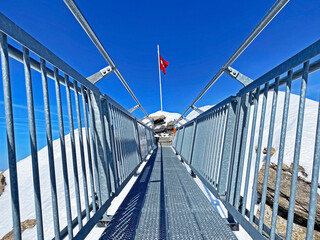 Peak walk on the Suspension bridge between two mountain peaks (Travel destination Glacier 3000) or...