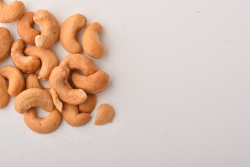 Heap of cashew nuts isolated on white background.