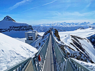 Peak walk on the Suspension bridge between two mountain peaks (Travel destination Glacier 3000) or...