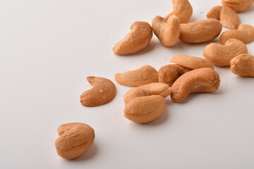 Heap of cashew nuts isolated on white background.