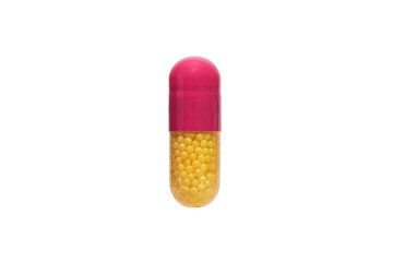 Close up yellow and pink medical pill or supplements in soft gel capsule