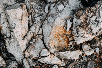 Mining process. Rocks for mining. Big gray limestone.