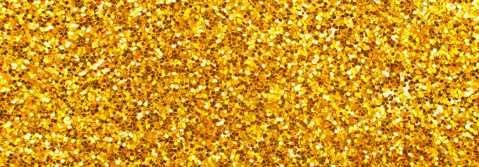 glittering background of golden sequins closeup. Sparkle festive texture. banner - obrazy, fototapety, plakaty