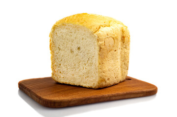 Fresh white wheat homemade bread on a wooden board, isolate. Homemade cakes, pastries
