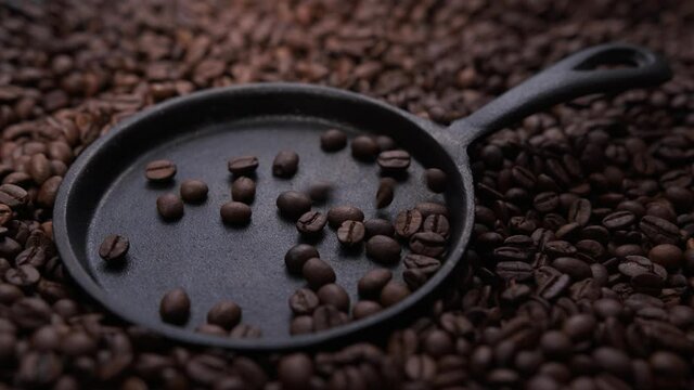 coffee beans fall into the pan