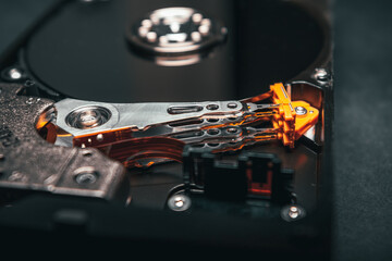 Close up of computer hard disk or hard drive internal mechanism hardware. Ideal for technology or buisiness background.