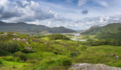 Beautiful panorama with Irish iconic viewpoint, Ladies View and Lakes of Killarney. Valley and mountains with dramatic sky, Rink of Kerry, Ireland
