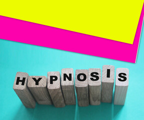 HYPNOSIS word on wooden blocks. Psychology hypnotherapy concept