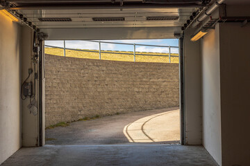 Close up view of exit from underground garage with automatic gates. Sweden.