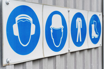 Safety signs and posters of personal protective equipment at work
