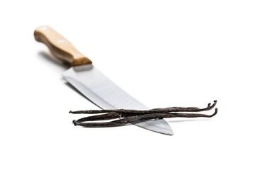 Obraz premium Vanilla pods on knife. Sticks of vanilla